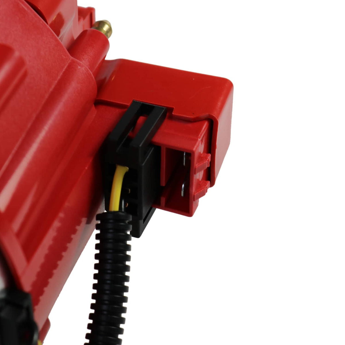 Close-up of red ignition distributor side wiring connector and black electrical lead