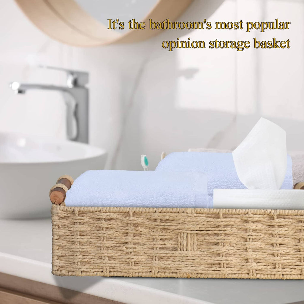 Beige woven paper rope storage basket with rope handles, open top on bathroom counter.