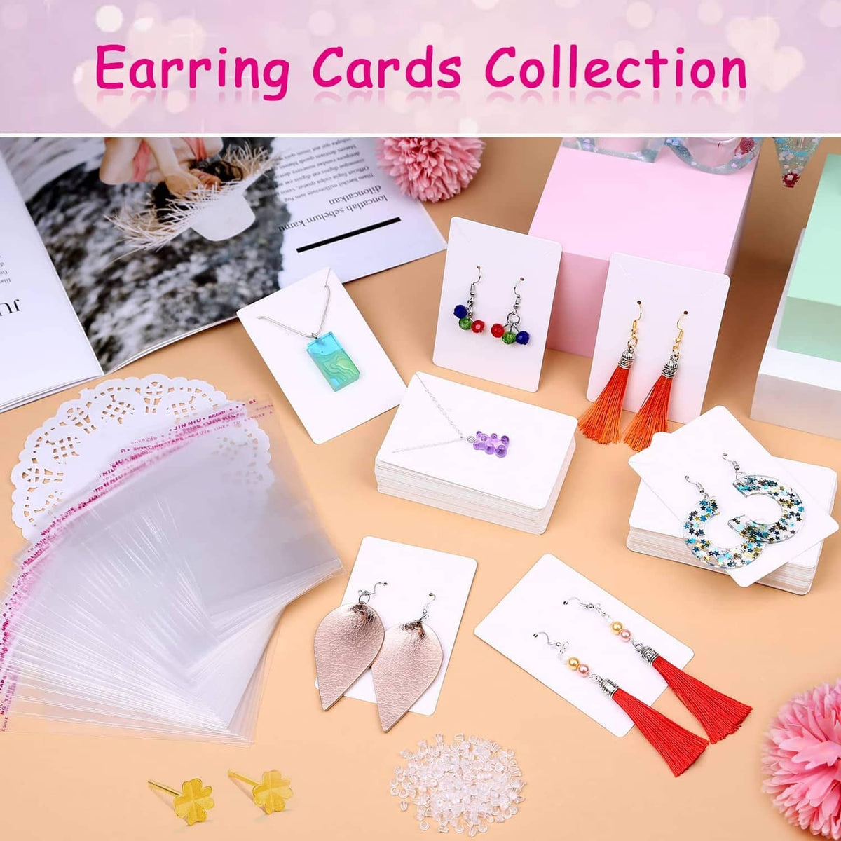 Assorted white earring display cards with various earrings on card inserts