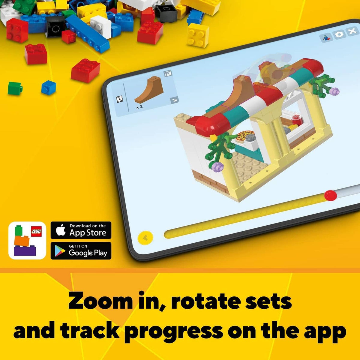 LEGO toy set with colorful bricks and tablet showing build zoom and progress