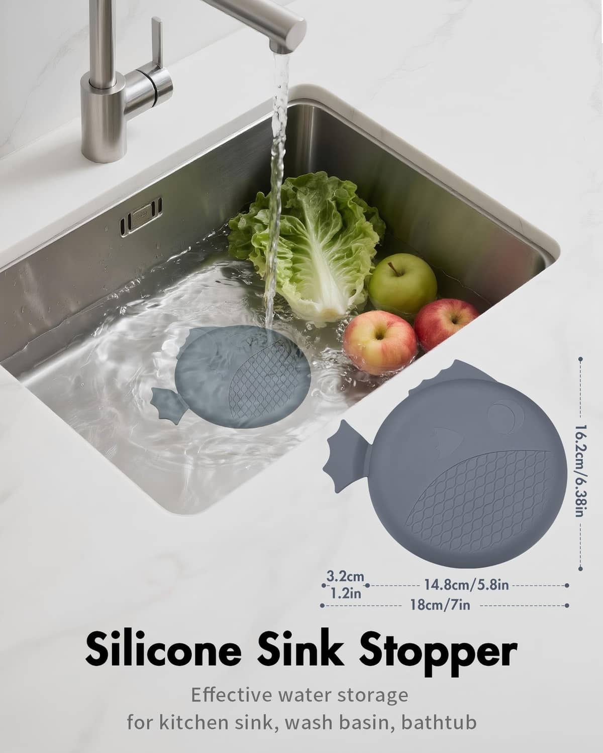 Dark gray silicone sink stopper covering the drain in a stainless sink