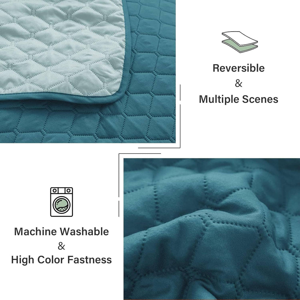 Teal reversible quilt showing diamond-quilt texture on both sides, close-up