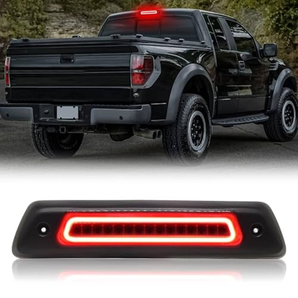 LED third brake light with smoked lens, red LED strip glowing on truck tailgate