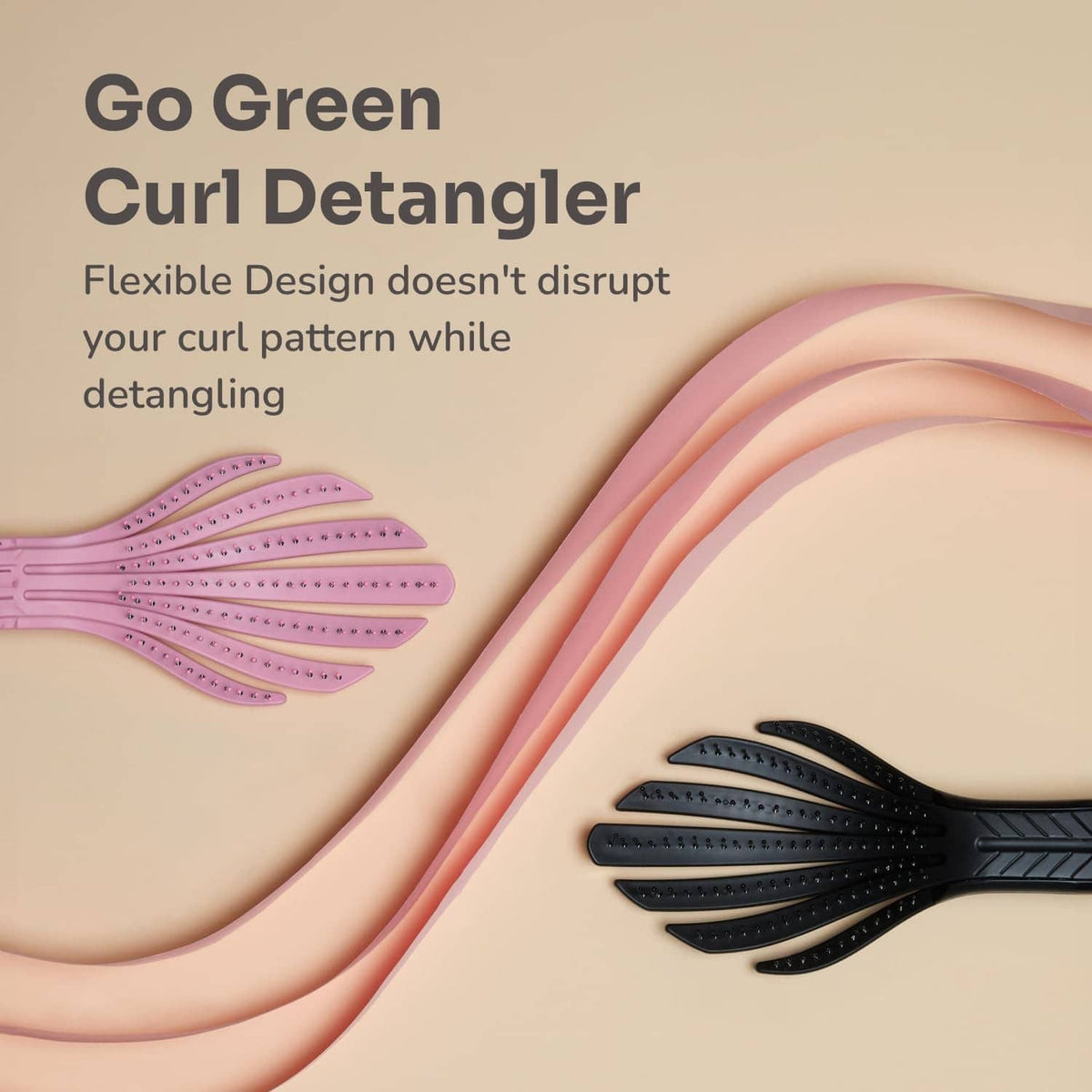 Pink and black Go Green curl detangler brush with flexible pin teeth