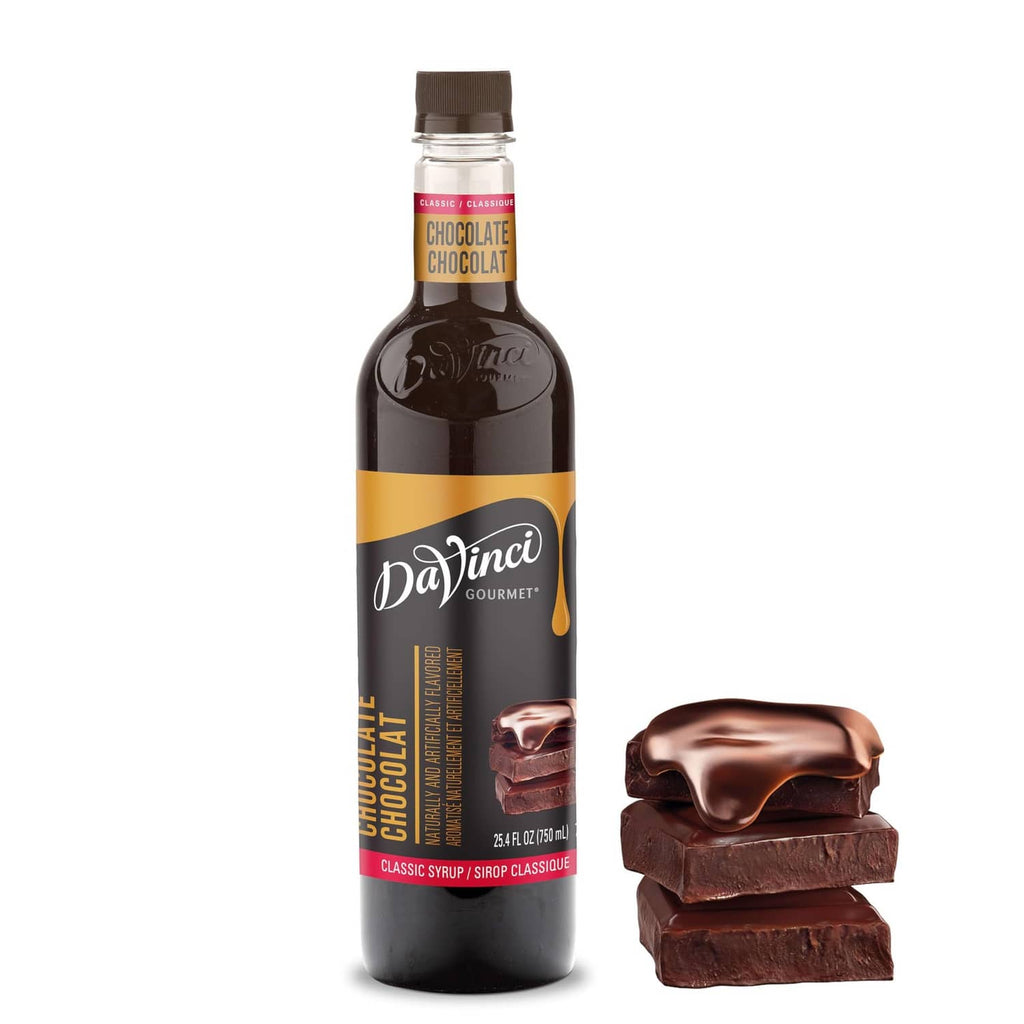 Chocolate syrup bottle with dark brown label and chocolate bar pieces