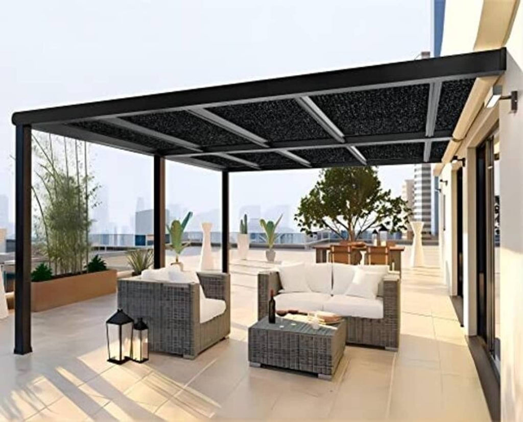 Outdoor pergola with a black shade cloth panel covering the top