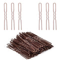 U-shaped hair pins in copper tone, several pins laid out and bundled