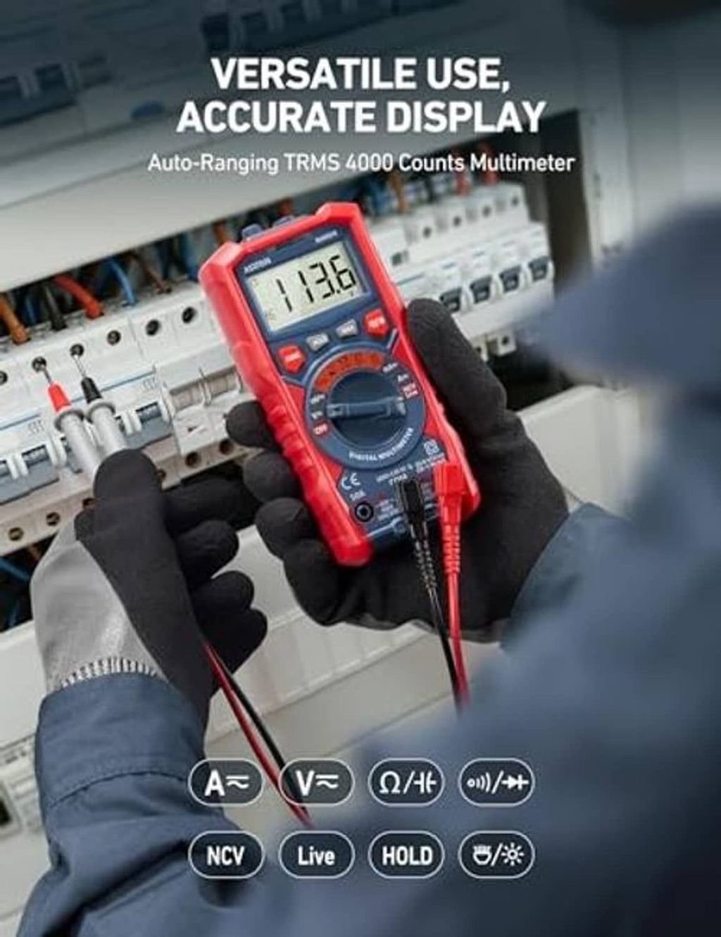 Red digital TRMS multimeter held in gloved hand with connected test leads