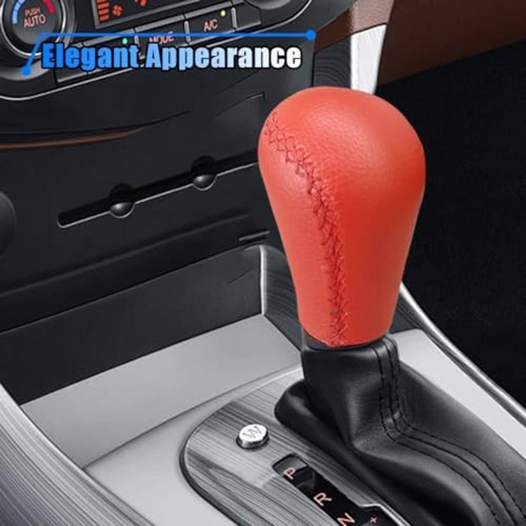 Red leather shift knob with black base installed in vehicle gear area