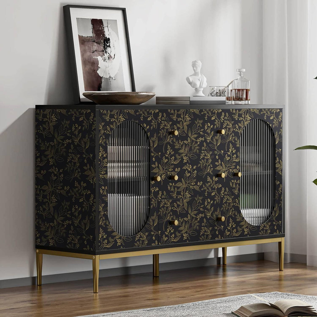 Black and gold botanical wallpaper covering the back of a console cabinet