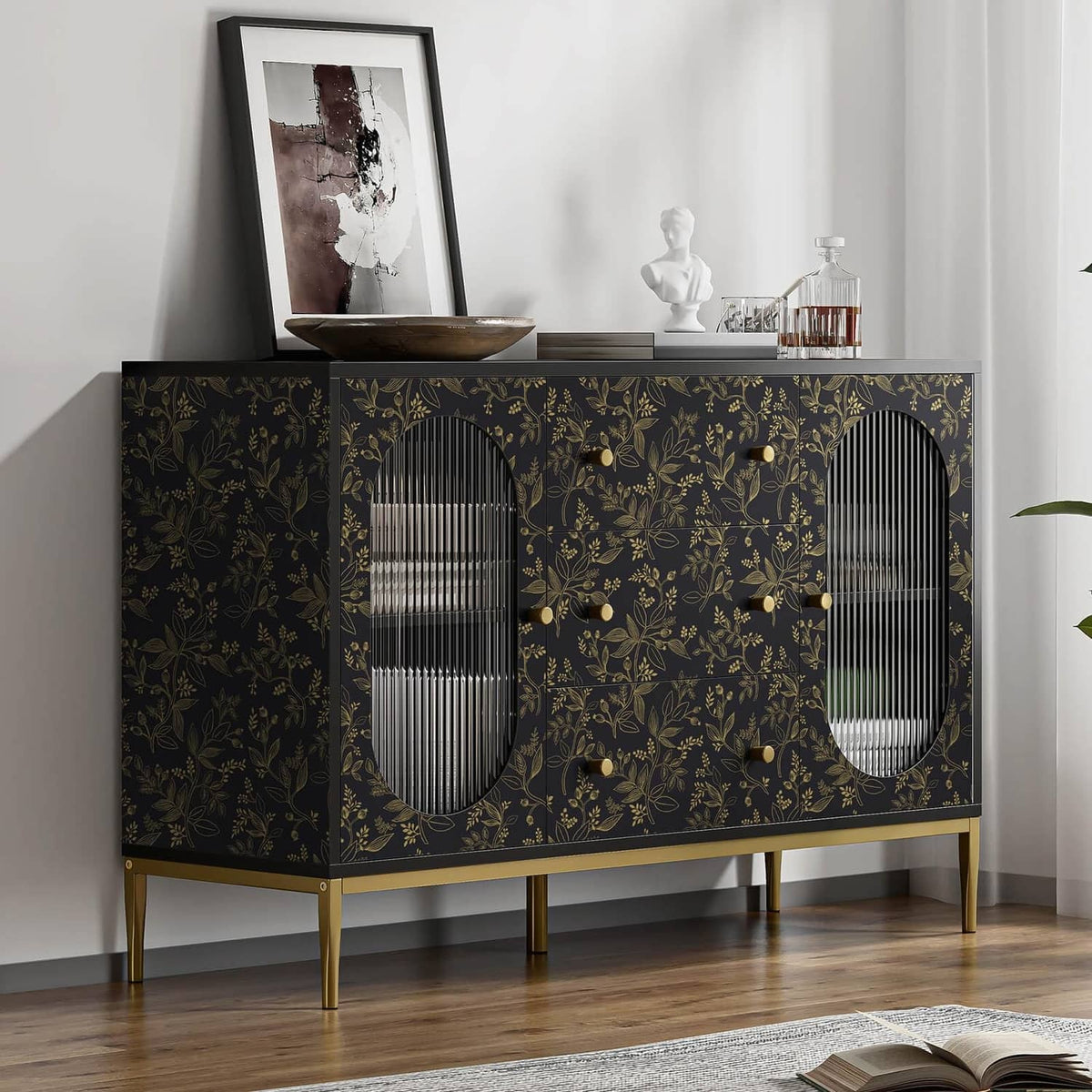 Black and gold botanical wallpaper covering the back of a console cabinet