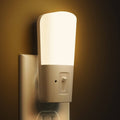 White plug-in LED night light with built-in light sensor and dimmer