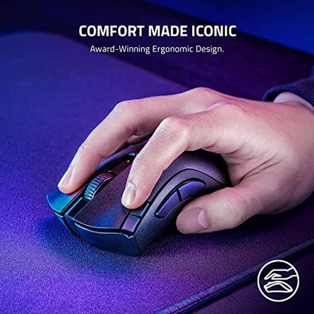 Black ergonomic gaming mouse held in hand, showing side grip contours