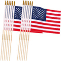 Set of small American flag lawn flags on wooden stakes, red stripes and blue stars