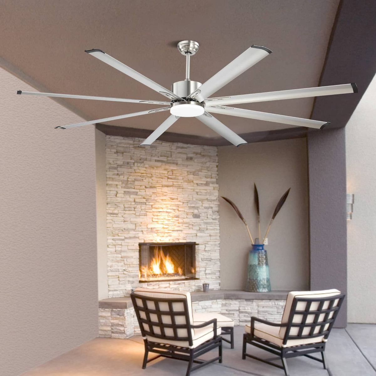 Brushed nickel ceiling fan with white 8 blades and integrated light in an outdoor patio