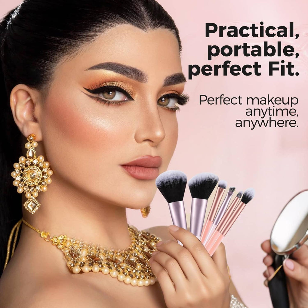 Woman holding mini makeup brushes; set includes lilac, rose-gold, and orange-handled brushes