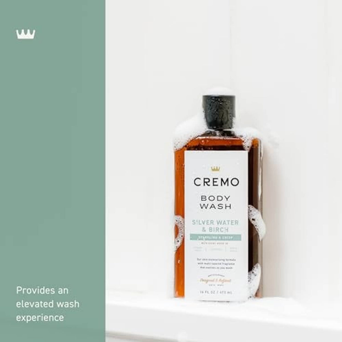 Cremo body wash bottle with Silver Water & Birch label under foam, black cap