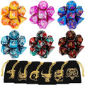 Set of multicolor polyhedral RPG dice, orange, purple, and blue with white number faces