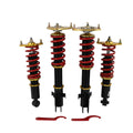 Full coilover suspension struts kit with red coil springs, black shocks, gold top mounts