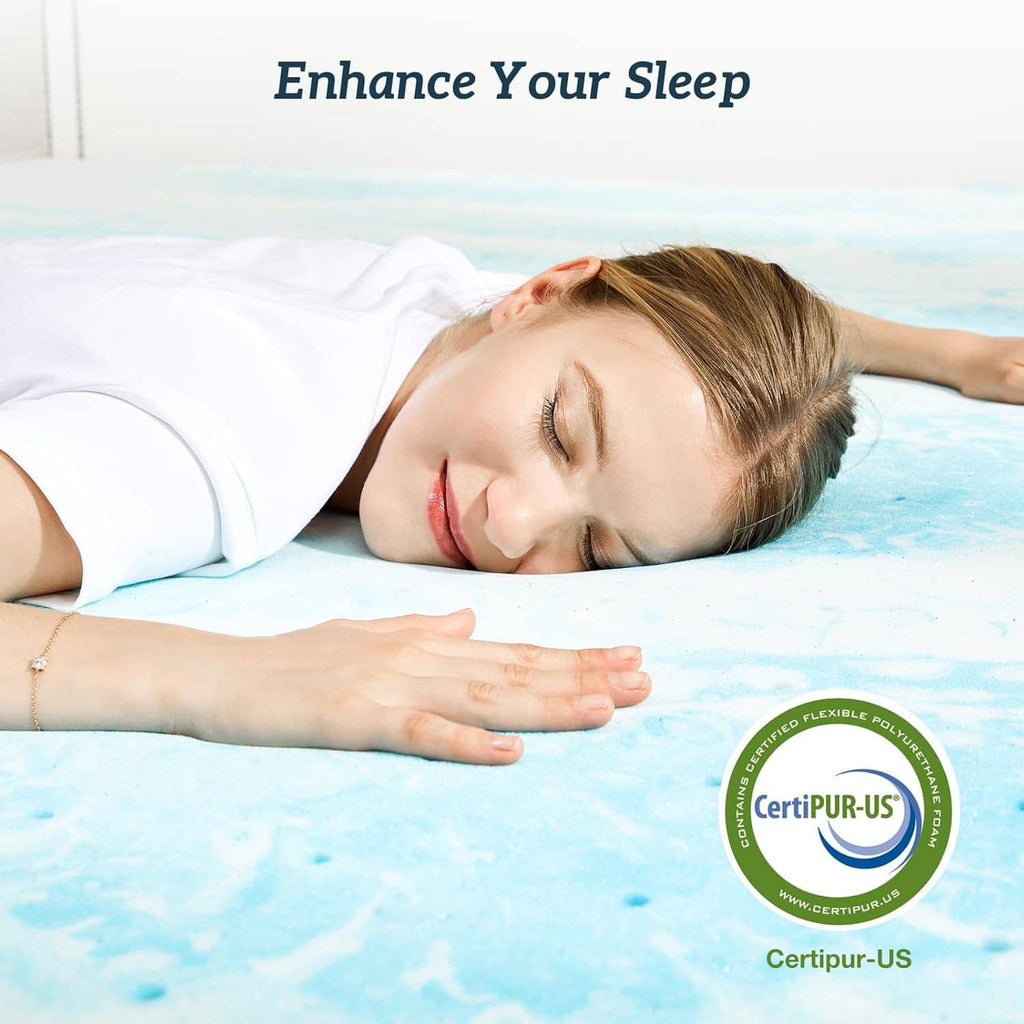 Blue memory foam mattress topper on a bed with sleeping person lying on top