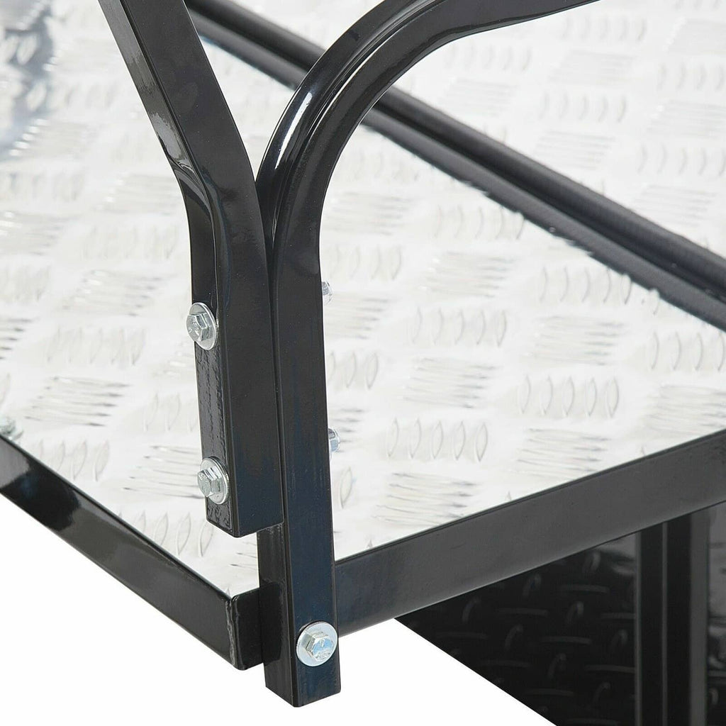 Diamond-plate cargo bed corner with black support posts and mounting bolts on frame
