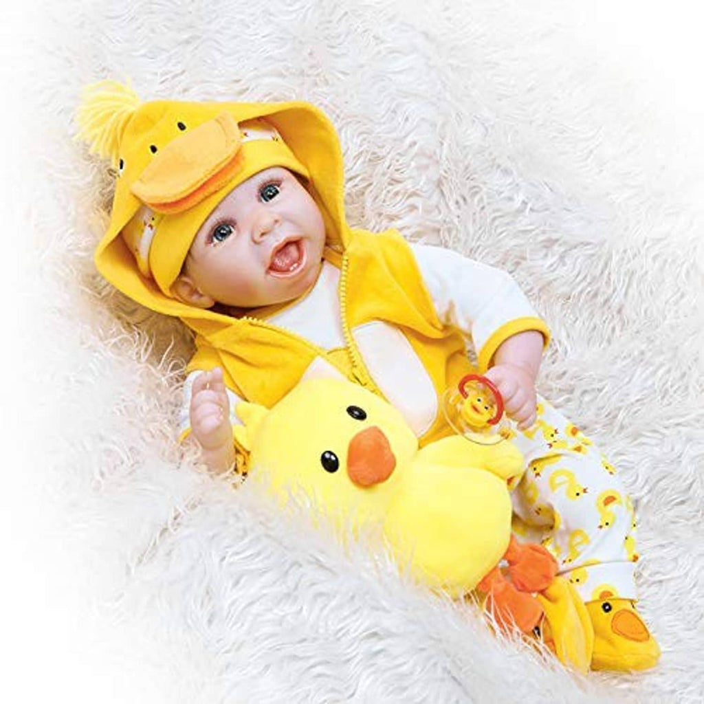 Baby doll in yellow duck hooded outfit with patterned pants and duck hat