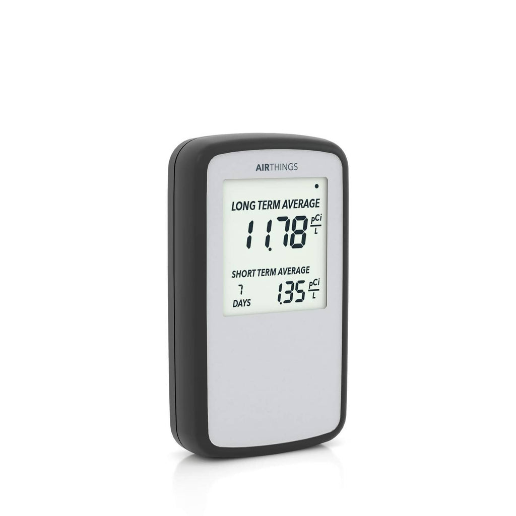 Black portable radon detector with LCD showing long/short term average readings