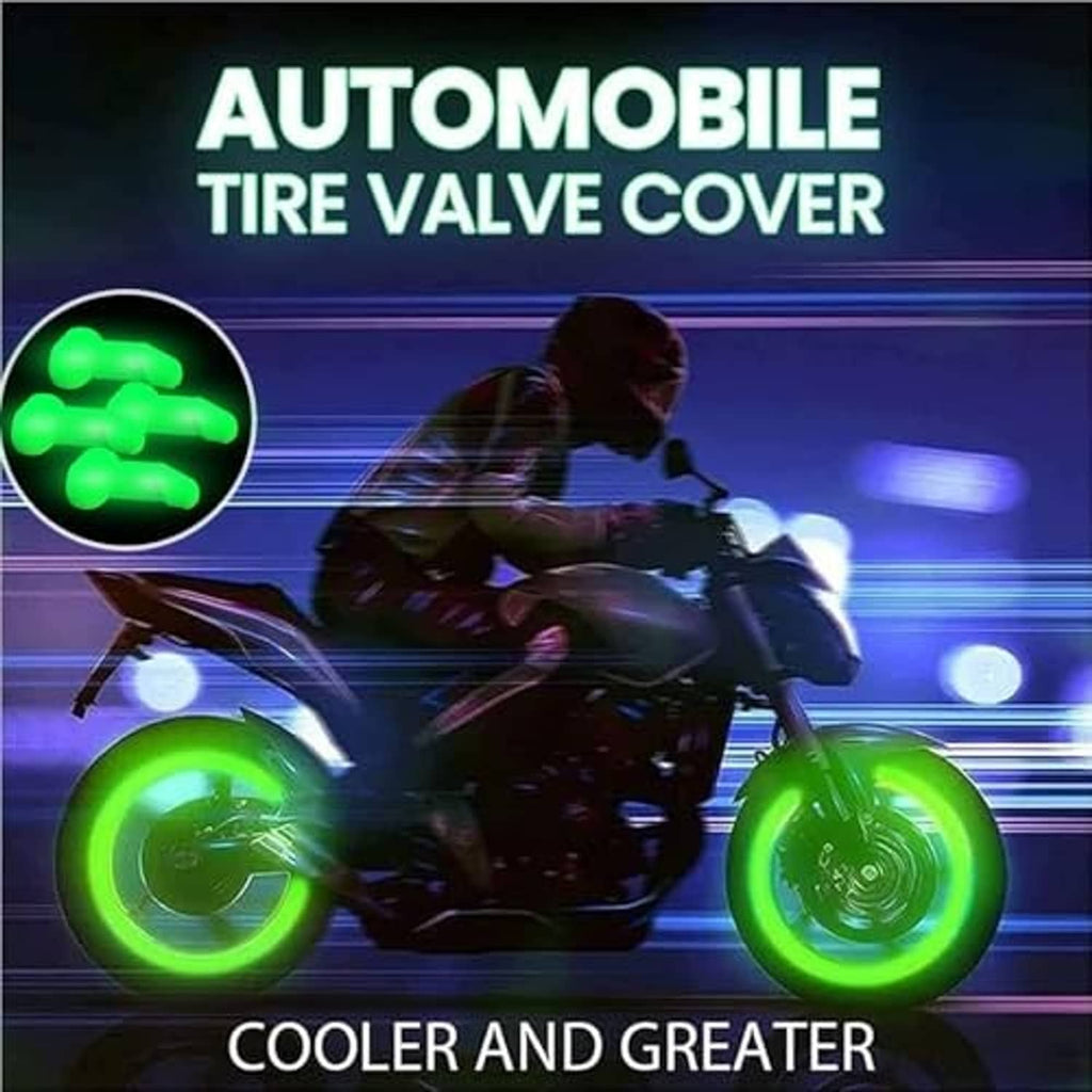 Four glow green automobile tire valve covers on stems