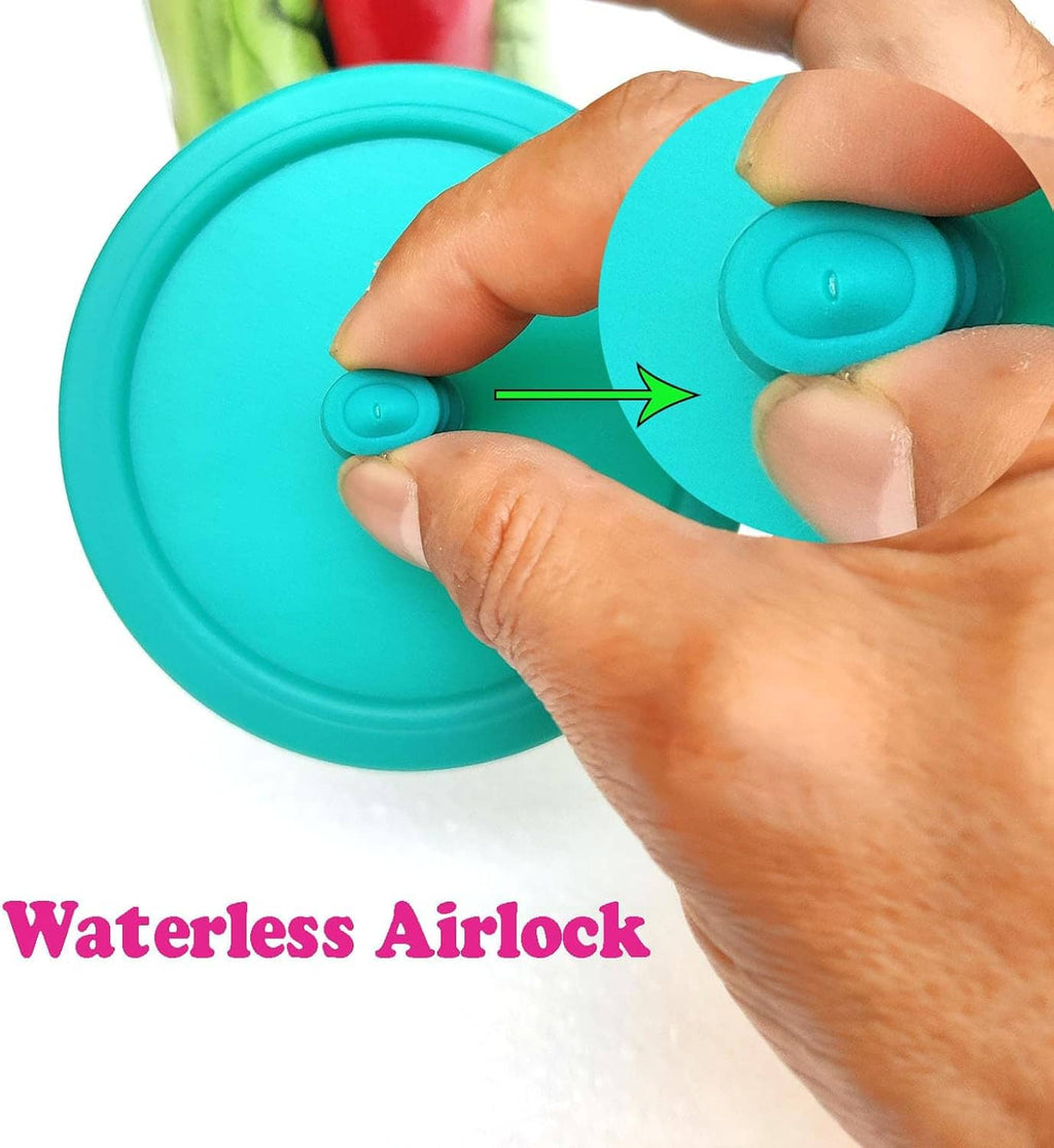 Teal waterless airlock fermentation lid with built-in valve, fingers pressing into place