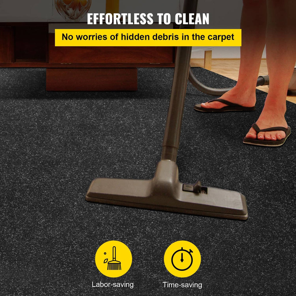 Charcoal black marine carpet mat with vacuum head on speckled surface