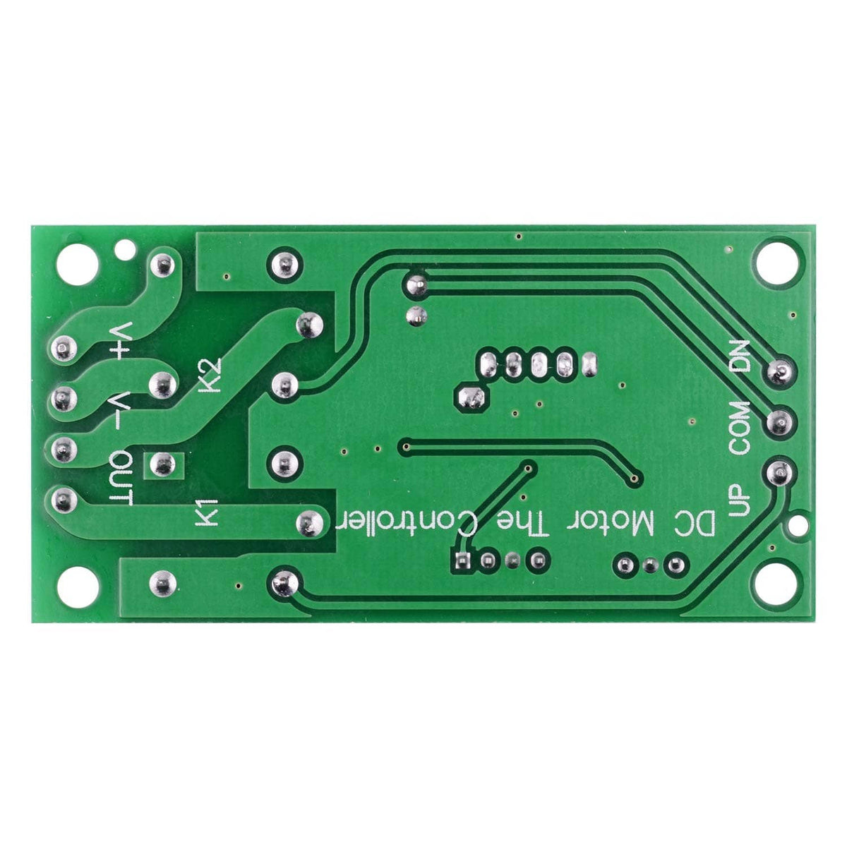 Back of green RF remote switch circuit board with copper traces and mounting holes