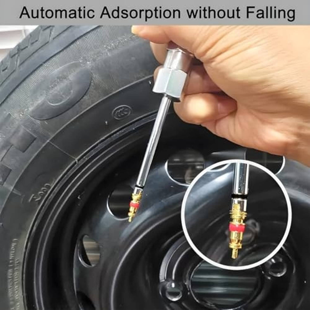 Tire valve core removal tool in use on a wheel valve, hand holding white handle
