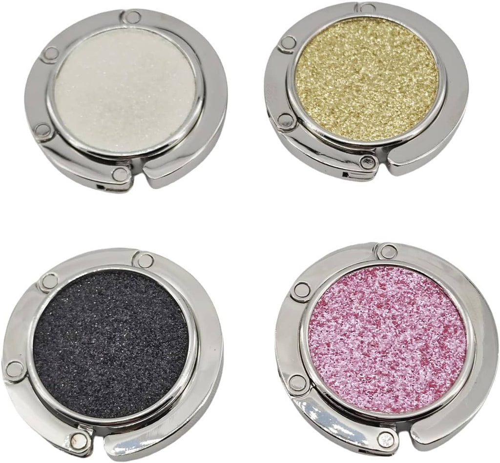 Set of four foldable purse hooks with silver frames and glitter pads in white, gold, dark gray, pink
