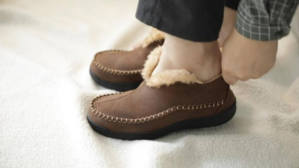 Brown moccasin bootie slippers with beige shearling lining and braided stitched trim