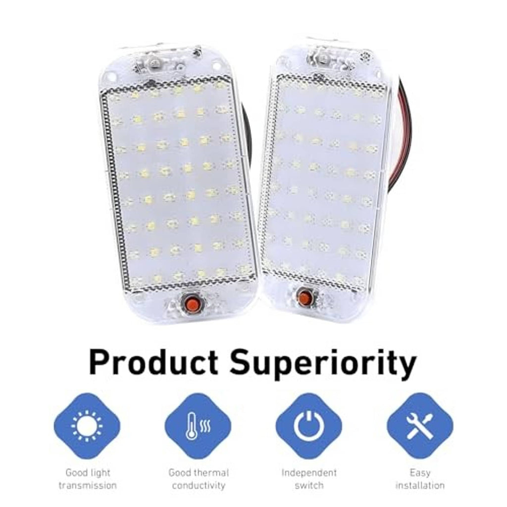 Two clear dome LED compartment lights with wire leads and orange button at bottom