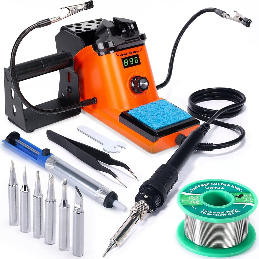 Soldering station kit with orange base, helping hands stand, iron, sponge, and solder wire spool