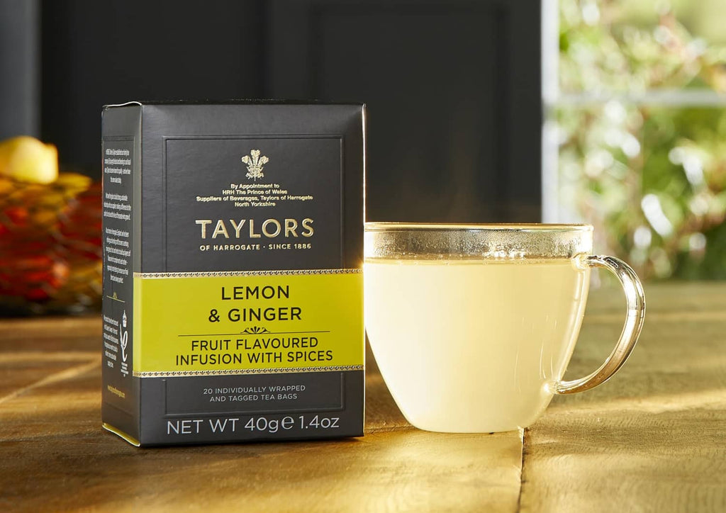 Lemon and ginger tea infusions box with cup filled with herbal tea
