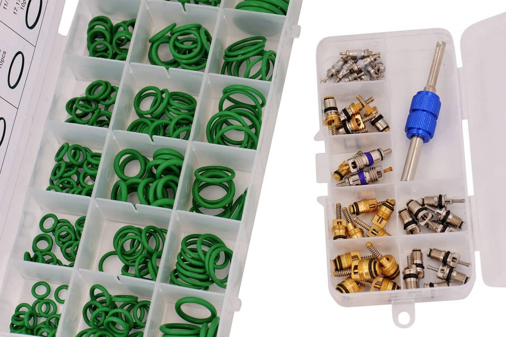 Open organizer with rows of green O-rings and mixed valve cores plus blue tool.