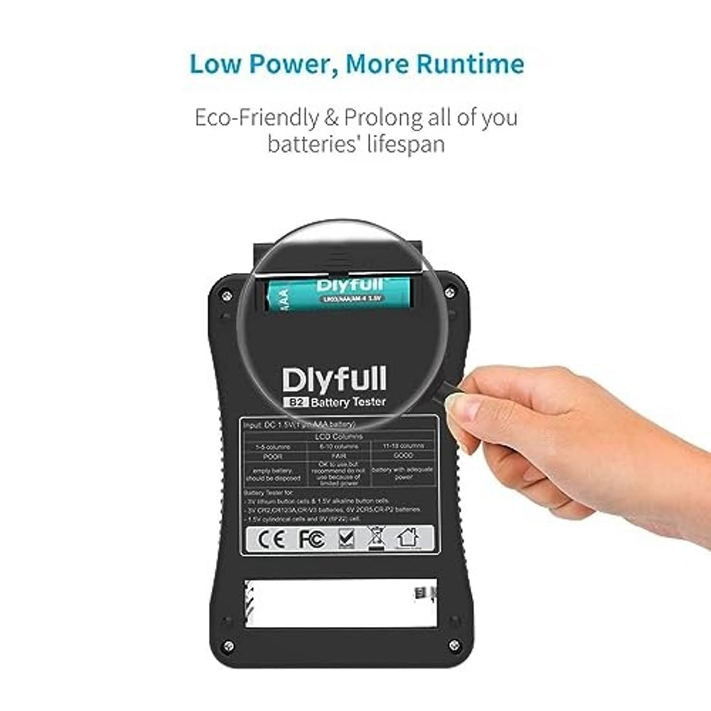 Battery tester with top LCD readout and visible battery test ports, held in hand