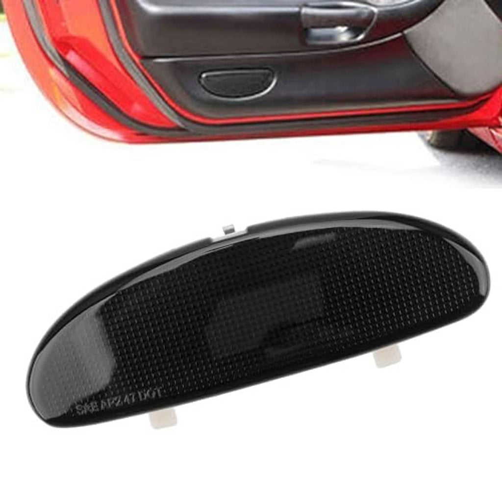 Black oval reflector plate for door panel, textured surface and snap tabs