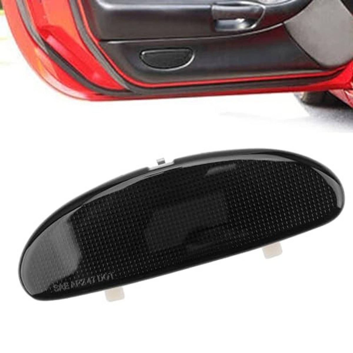 Black oval reflector plate for door panel, textured surface and snap tabs