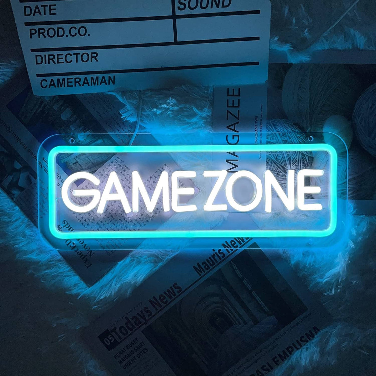 Ice blue GAME ZONE neon sign with glowing rounded rectangle border and white text