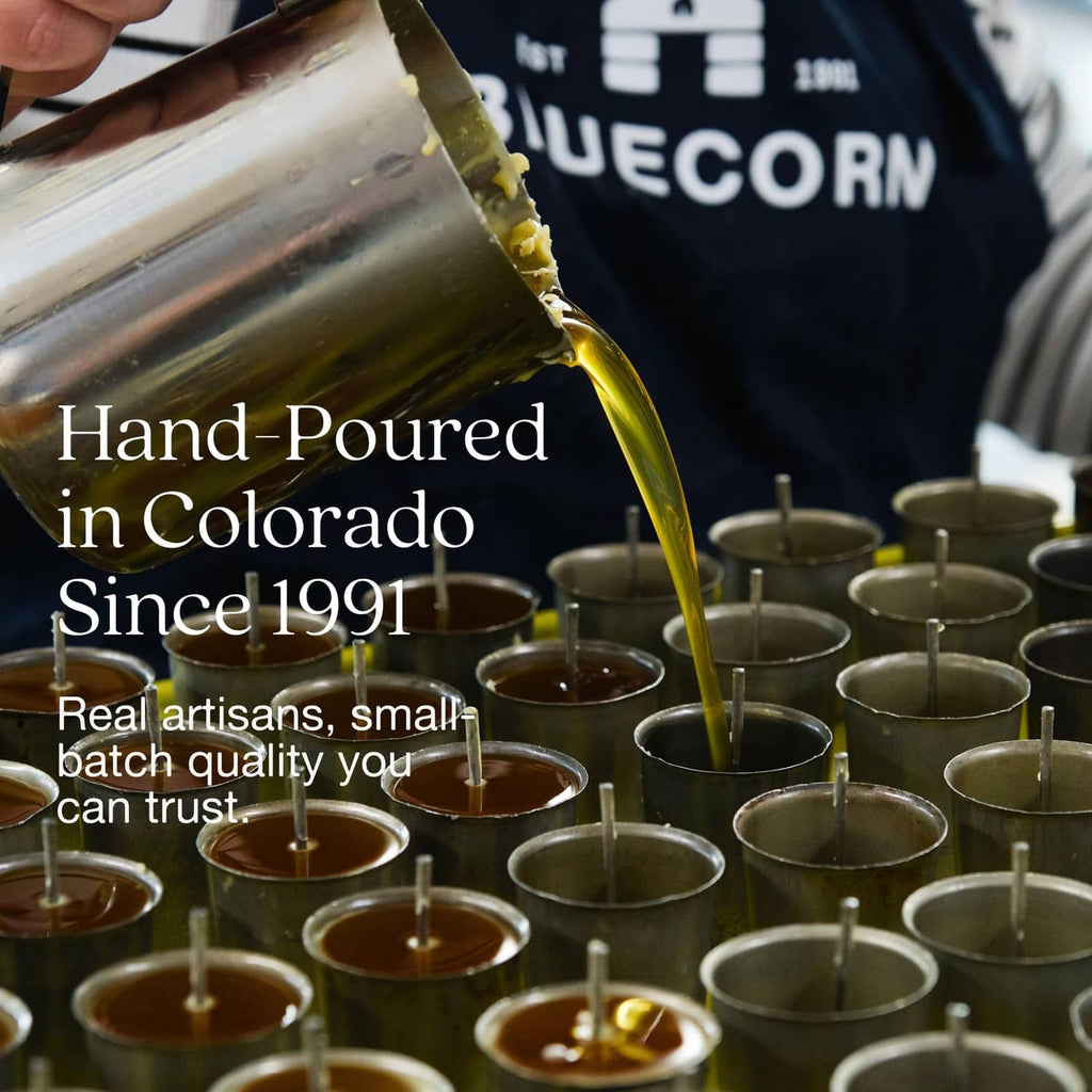 Hand-poured beeswax candle pour into small green jars, with Bluecorn branding
