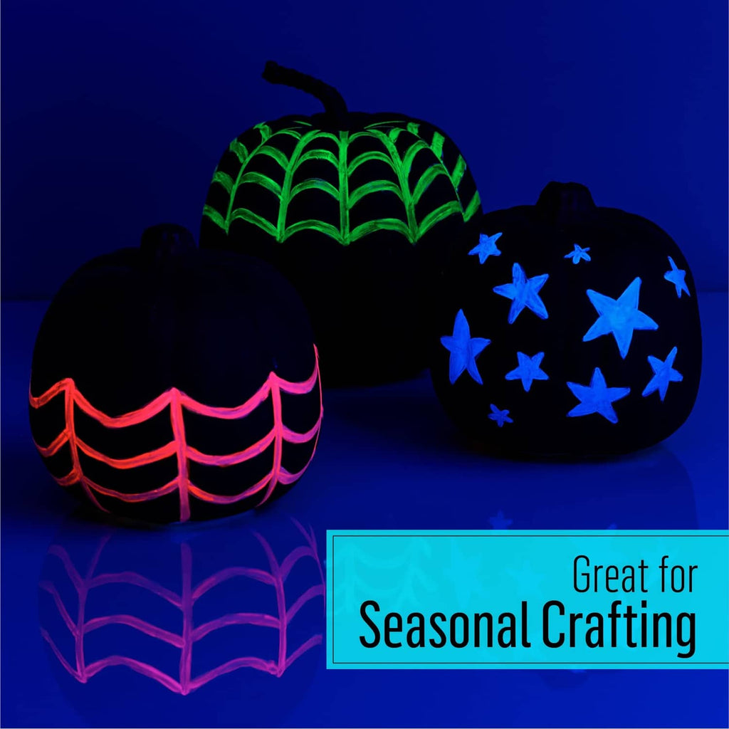 Glow-in-the-dark paint on seasonal craft shapes with green pattern glow
