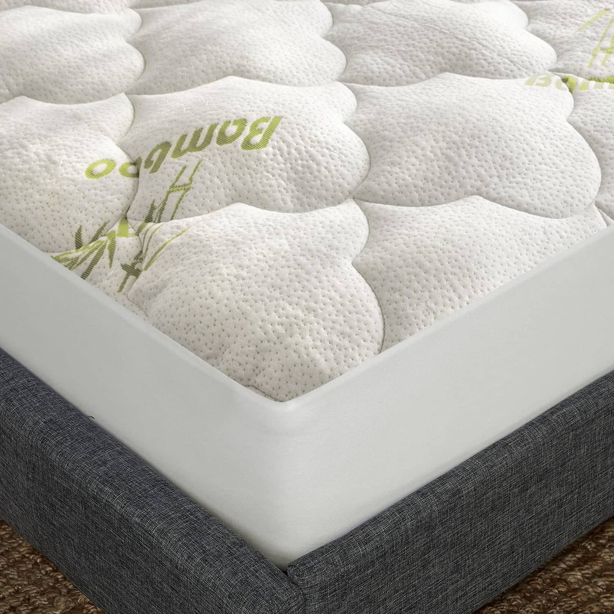 Queen mattress pad cover, white quilted top with green bamboo print, elastic skirt