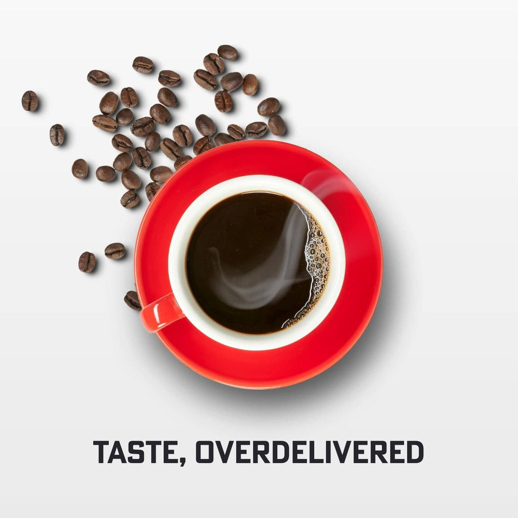 Red coffee cup filled with dark brewed coffee and visible crema