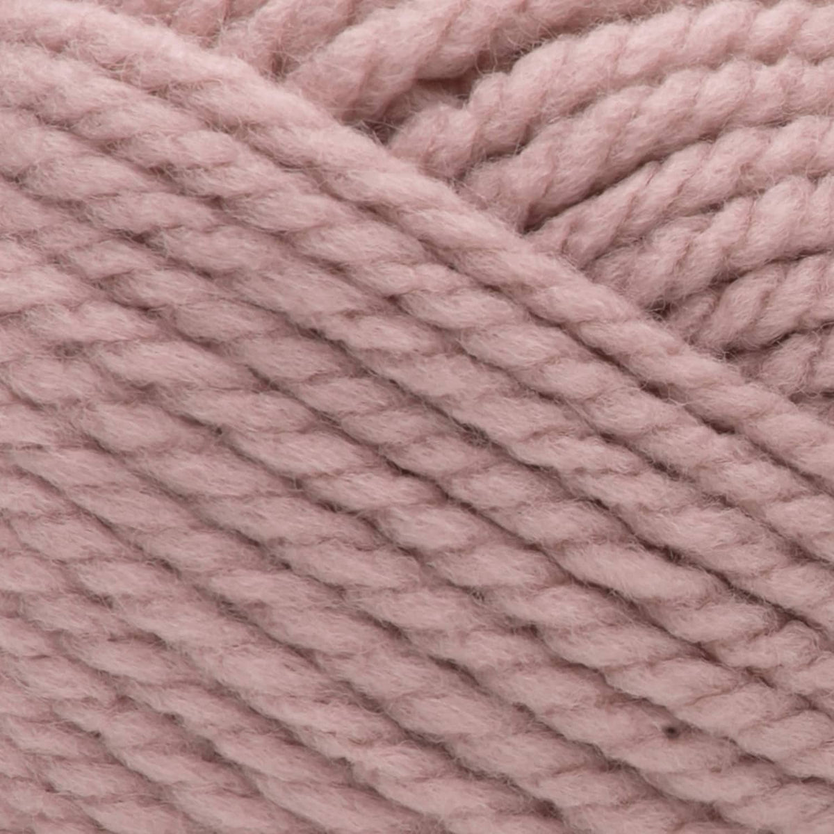 Super chunky acrylic yarn texture with thick rose-pink knit loops