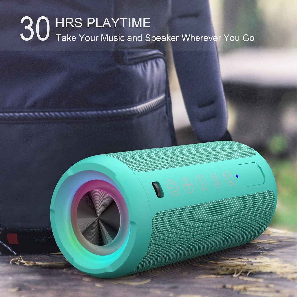 Teal waterproof Bluetooth speaker with glowing RGB rings and mesh speaker body outdoors