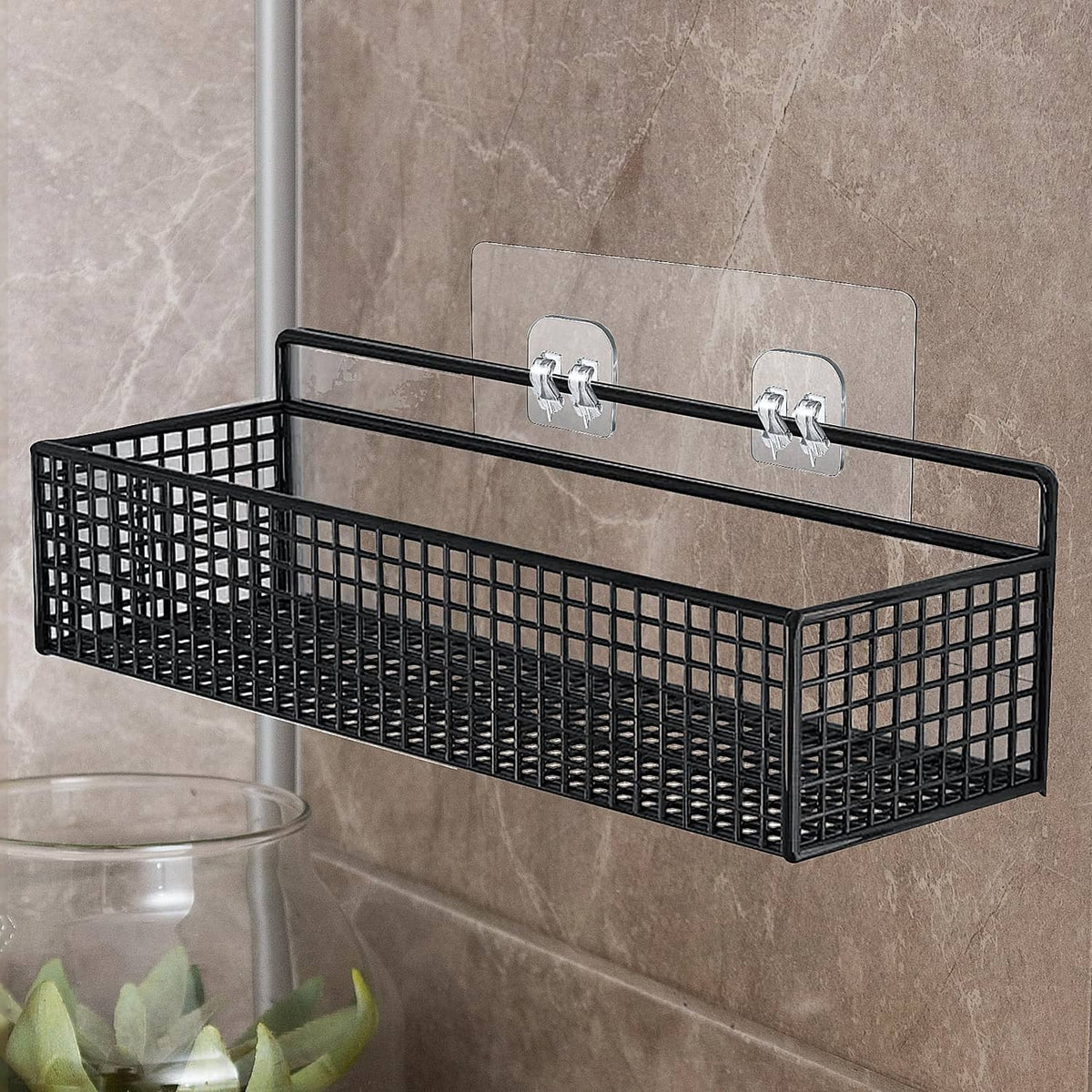 Black shower caddy with two adhesive hooks for mounting on tile wall