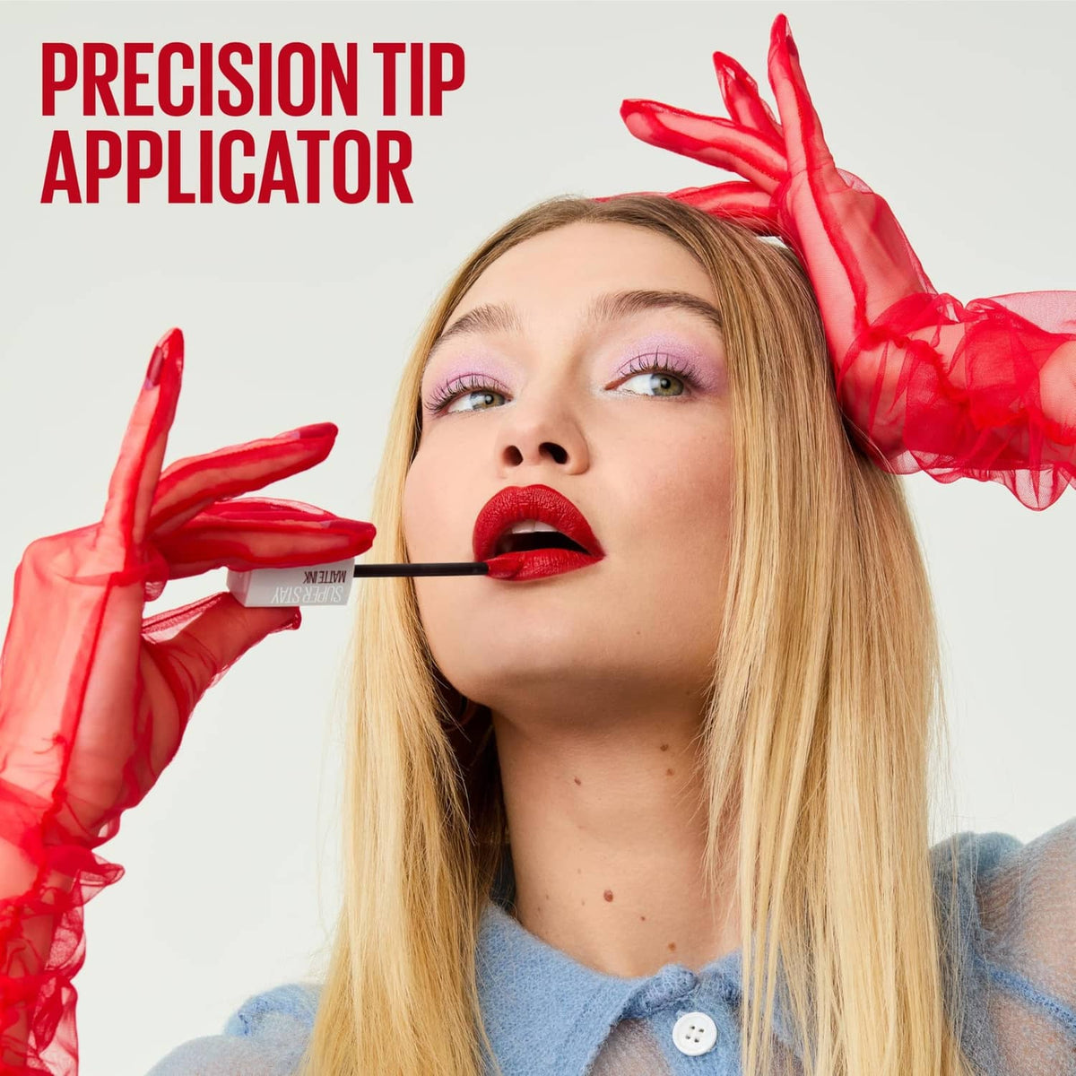 Red matte liquid lipstick application with precision applicator tip